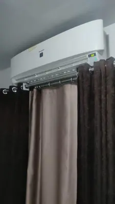 a room with a curtain and a televisionidding at Fully furnished Studio, At Tiba View, NUMBER R75 in Hurghada