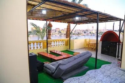 a living room with a couch and a table at Nubian Dreams Guest House in Aswan