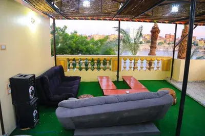 a living room with a couch and a table at Nubian Dreams Guest House in Aswan