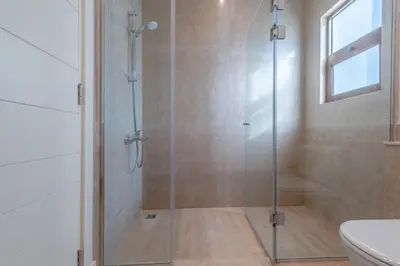 a shower with a glass door in a bathroom at Fresh Breeze High-End 2BR Villa with Private Pool, Sabina, El Gouna in Hurghada