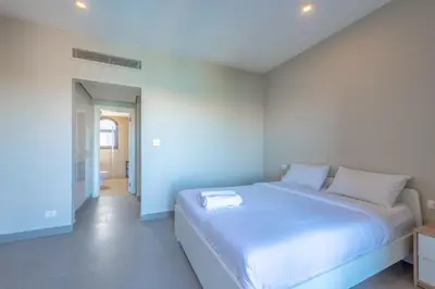 a bedroom with a large white bed in a room at 3BR Family Villa in Sabina, El Gouna. Lagoon & Private Pool in Hurghada