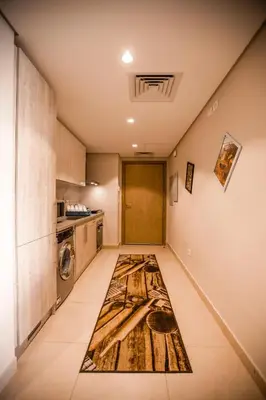 a kitchen with a rug on the floor at Luxurious Sea view 2 BR & private Garden to the pool at Mangroovy in Hurghada