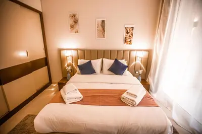 a bedroom with a large bed with towels on it at Luxurious Sea view 2 BR & private Garden to the pool at Mangroovy in Hurghada