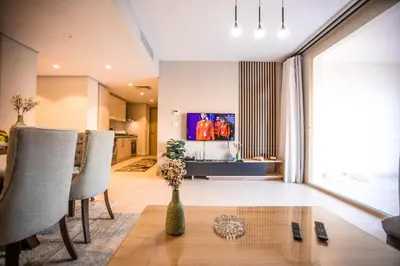 a living room with a vase on a table at Luxurious Sea view 2 BR & private Garden to the pool at Mangroovy in Hurghada