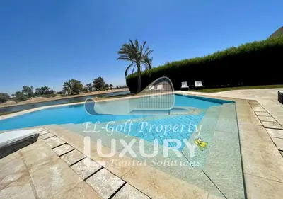 a swimming pool with a sign that reads le got property luxury at Villa 4 Bed Rooms-North Golf-GN24 in Hurghada