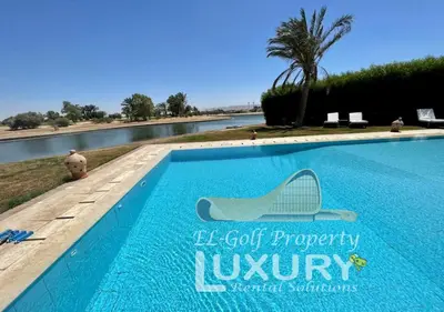 a swimming pool with a sign that reads le got property luxury at Villa 4 Bed Rooms-North Golf-GN24 in Hurghada