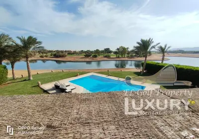 a villa with a swimming pool and a lake at Villa 4 Bed Rooms-North Golf-GN24 in Hurghada