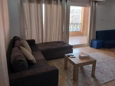 a living room with a couch and a coffee table at Selena Bay Resort luxury 1 bedroom Apartments in Hurghada