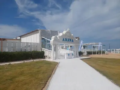 a large white building with a sign that reads akarma at Selena Bay Resort luxury 1 bedroom Apartments in Hurghada