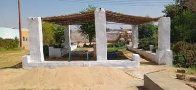 a gazebo in the middle of a garden at بيت شمس in Aswan