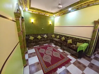 an overhead view of a room with a couch and a rug at Sabrina home in Aswan