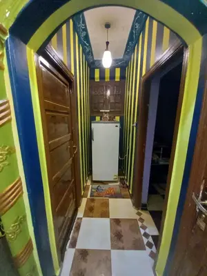 a kitchen with a colorful hallway with a refrigerator at Sabrina home in Aswan