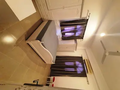 an overhead view of a staircase in a kitchen with a window at Family House in Luxor