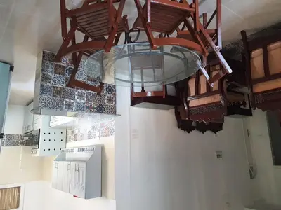 a chandelier hanging from the ceiling in a room at Family House in Luxor