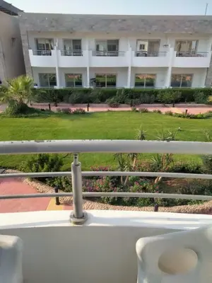 a balcony with a view of a building at منتجع سيسيليا cecelia resort in Hurghada