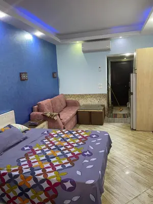 a living room with a bed and a couch at منتجع سيسيليا cecelia resort in Hurghada