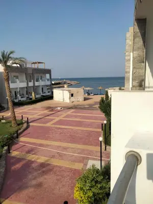 an empty parking lot with the ocean in the background at منتجع سيسيليا cecelia resort in Hurghada