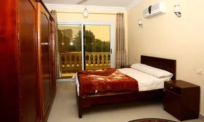 a bedroom with a bed and a window at Egypt sun accommodation Spiritualities in Luxor