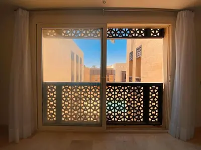 an open window with a view of a building at Nayah Stays, Amazing villa with private pool & 5 master suites in Hurghada