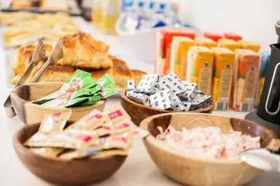 a table topped with bowls of different types of food at Nayah Stays, Amazing villa with private pool & 5 master suites in Hurghada