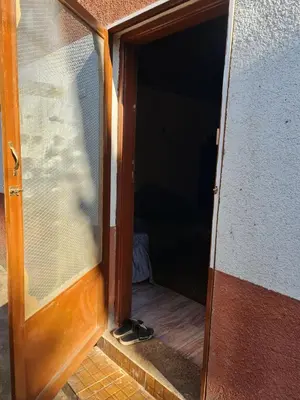 an open door with a pair of shoes in the doorway at Hamd Nubian Guest House in Aswan