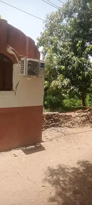 a house with a air conditioner on the side of it at Hamd Nubian Guest House in Aswan