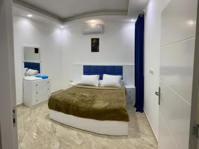 a small bedroom with a bed and a bathroom at selena bay in Hurghada