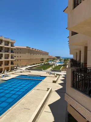 a swimming pool on the side of a building at selena bay in Hurghada
