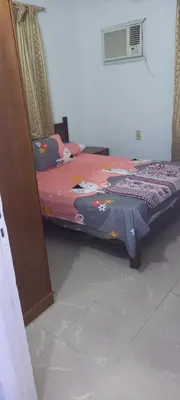 a bedroom with a bed with a hello kitty blanket at new ikea flat 1 in Hurghada