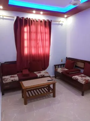 a living room with two couches and a table at new ikea flat 1 in Hurghada