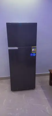 a black refrigerator is sitting in a room at new ikea flat 1 in Hurghada