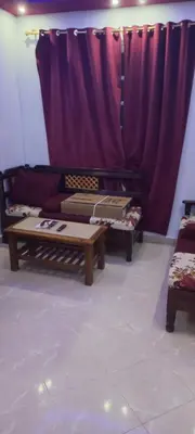 a living room with two tables and a couch at new ikea flat 1 in Hurghada