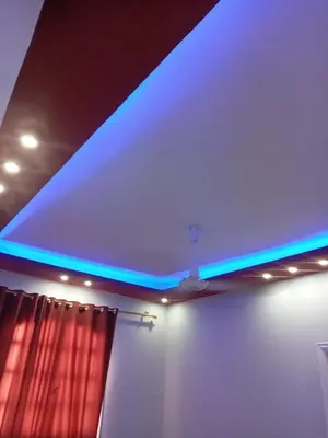 a blue light in a room with a curtain at new ikea flat 1 in Hurghada