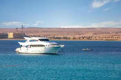 a white boat in the middle of the water at AJIRA Resort Sahl Hasheesh in Hurghada