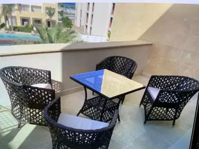 a table and chairs sitting on a patio at Elgouna Hurghada egypt mangroovy in Hurghada