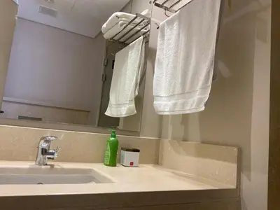 a bathroom with a sink and a mirror and towels at Elgouna Hurghada egypt mangroovy in Hurghada
