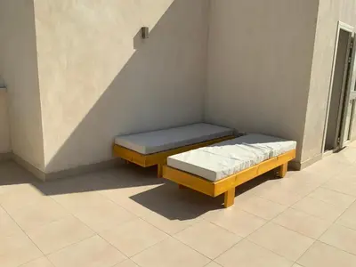 a bed sitting in a room under a staircase at Elgouna Hurghada egypt mangroovy in Hurghada