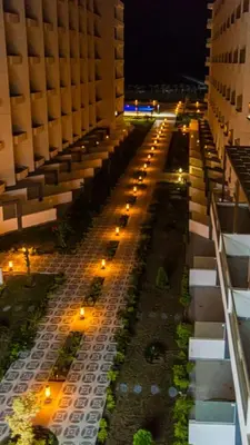 a view of a city street at night with lights at The Comfortable palace in Hurghada