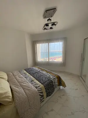 a bedroom with a bed and a basketball hoop at Blue Whale Hurghada Beach Front Apartments City Centre in Hurghada