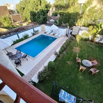 an overhead view of a backyard with a swimming pool at Ali Luxury Villa in Luxor