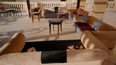 a lobby with couches and tables and chairs at New Sunset Resort in Aswan