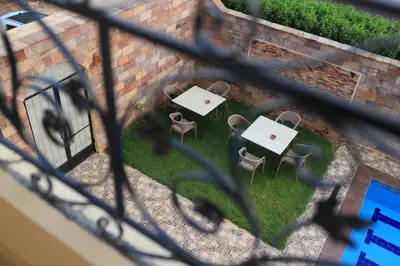 an overhead view of a patio with tables and chairs at Royal Mountain in Luxor