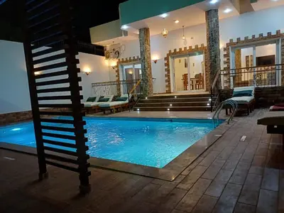 a swimming pool in the middle of a house at Twilight palace in Luxor