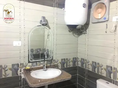 a bathroom with a sink and a mirror at DoroKa Nubian House in Aswan