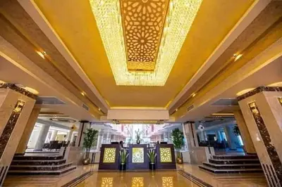 a large lobby with a ceiling with a chandelier at كذا بلانكا بيتش 220 in Hurghada