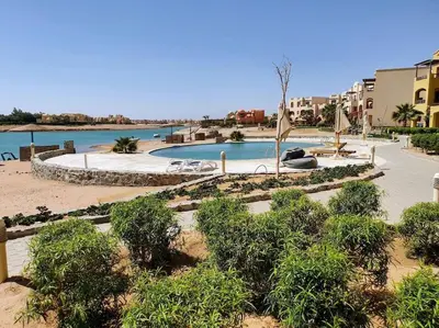 a view of a swimming pool in a resort at Brand New Waterfront Sabina Ground Floor Home in Hurghada