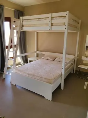 a bedroom with two bunk beds and a ladder at Brand New Waterfront Sabina Ground Floor Home in Hurghada
