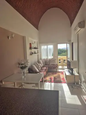a living room with a couch and a table at Makadi heights luxury complex in Hurghada