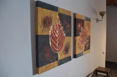 a group of four paintings hanging on a wall at Askyhomes in Hurghada