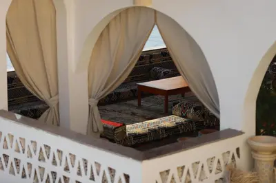 a living room with a couch and a table at Noprea Boutique Hotel in Aswan
